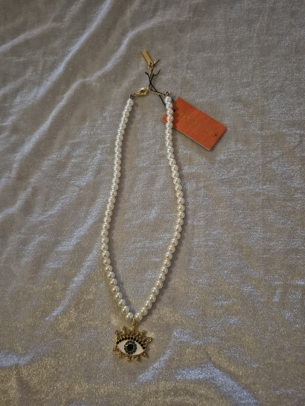 Kurt Geiger White Pearl Necklace with Gold Evil Eye Pendant